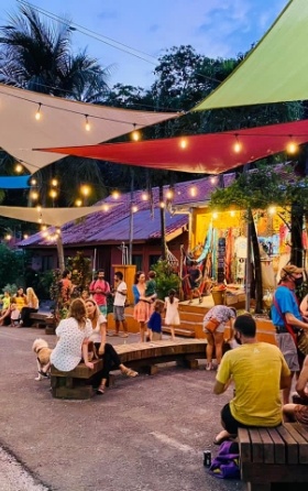 people gathering in evening on benches in downtown Montezuma