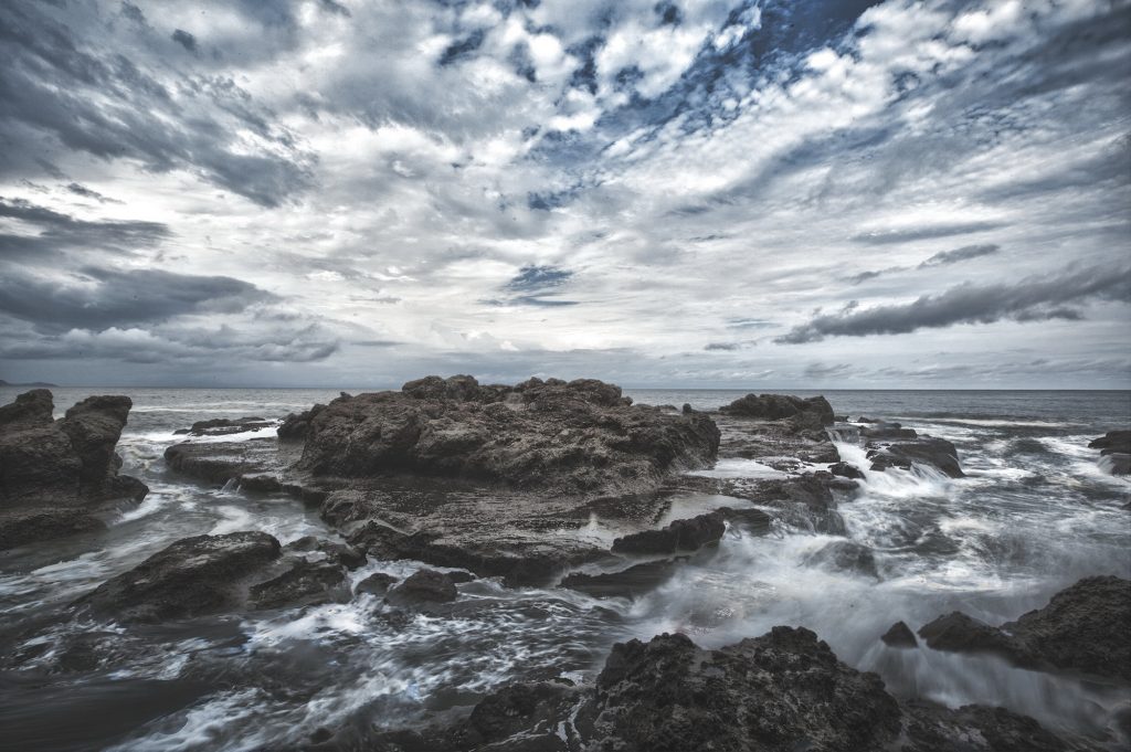 Rock formation with cloudy sky