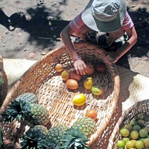Boy with fruit at Saturday Market